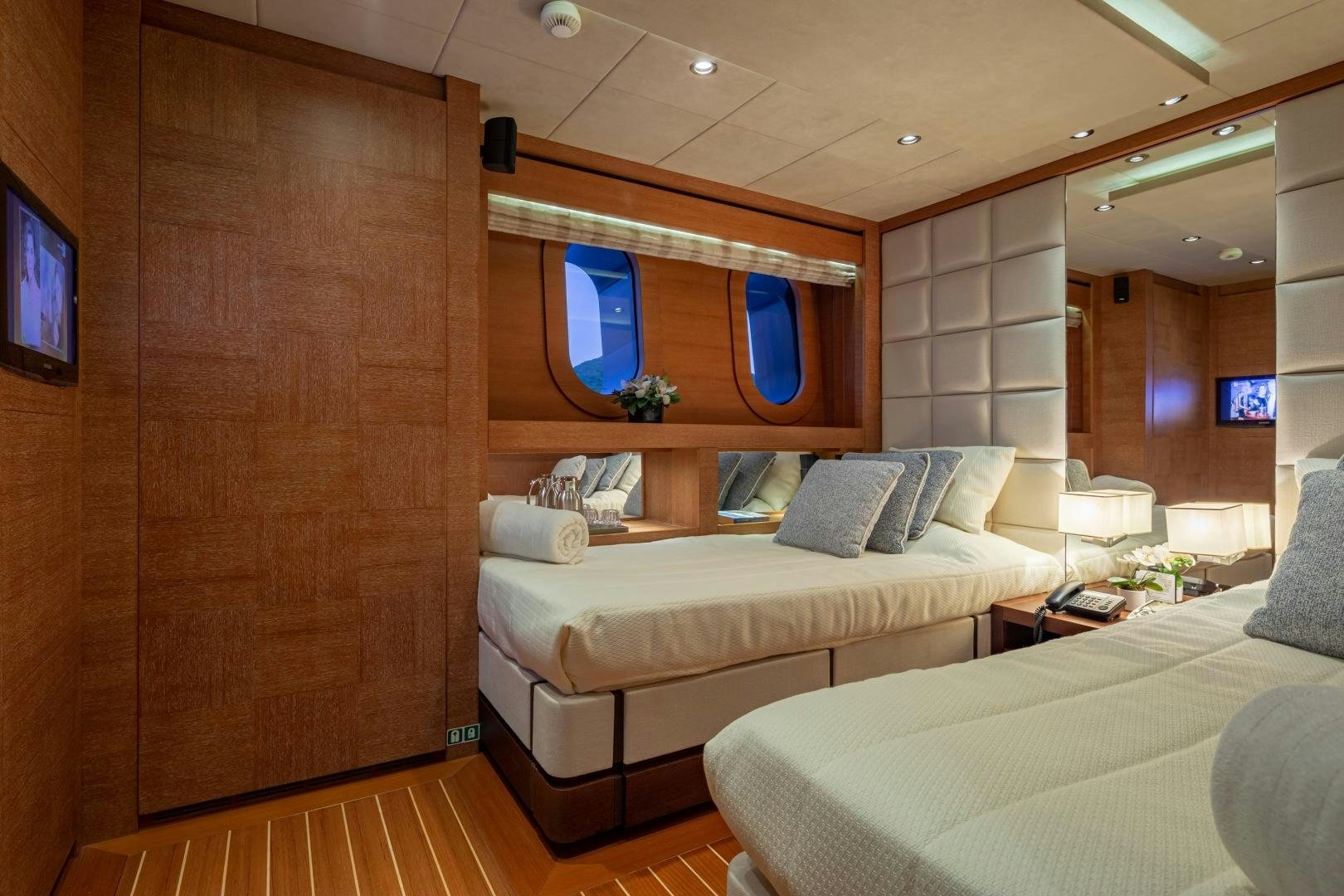 a room with a bed and a television aboard ZALIV III Yacht for Sale