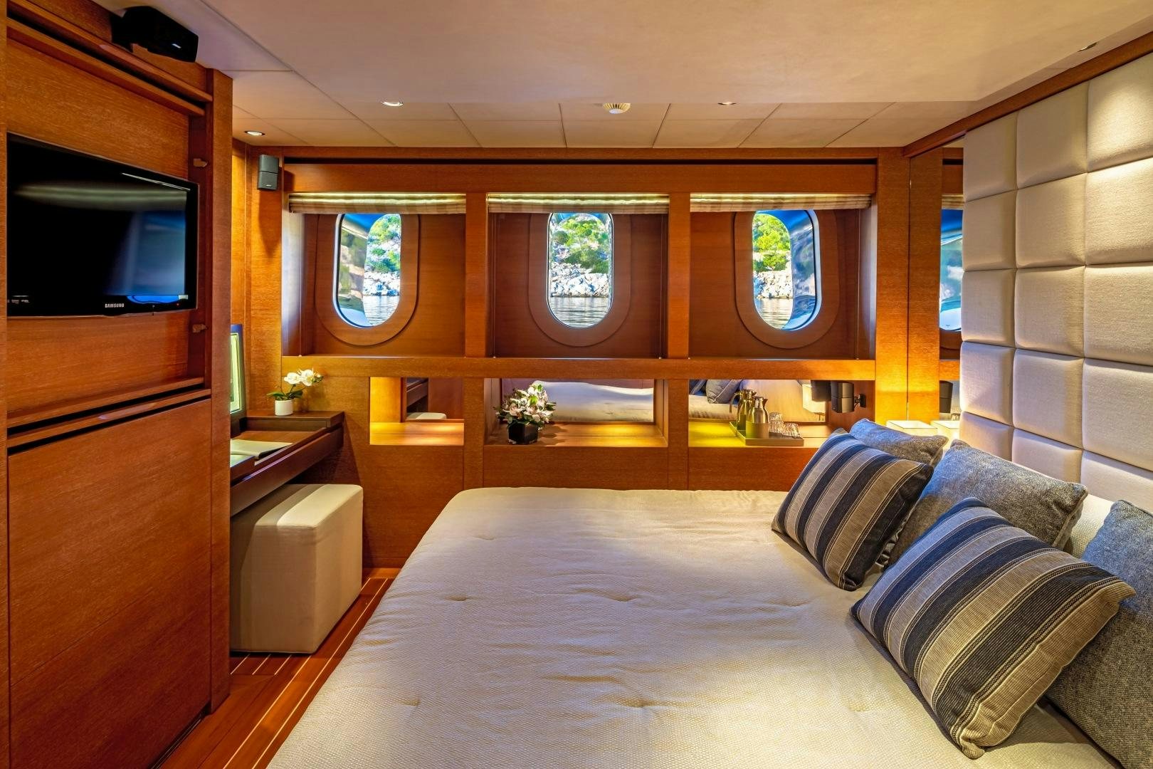a bed in a room aboard ZALIV III Yacht for Sale