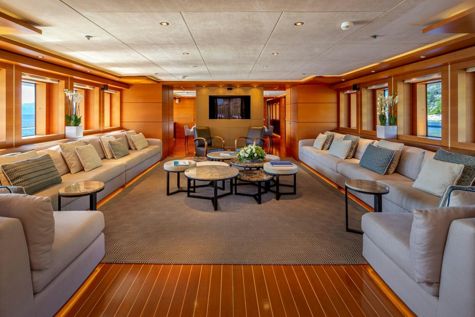 a living room with a couch and a coffee table aboard ZALIV III Yacht for Sale