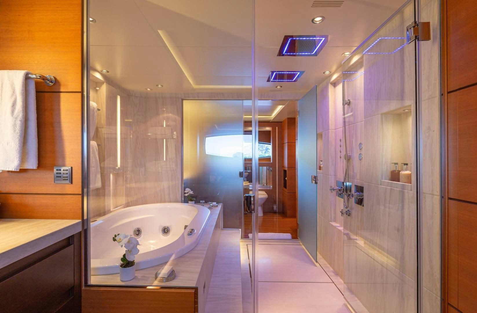 a bathroom with a tub and shower aboard ZALIV III Yacht for Sale