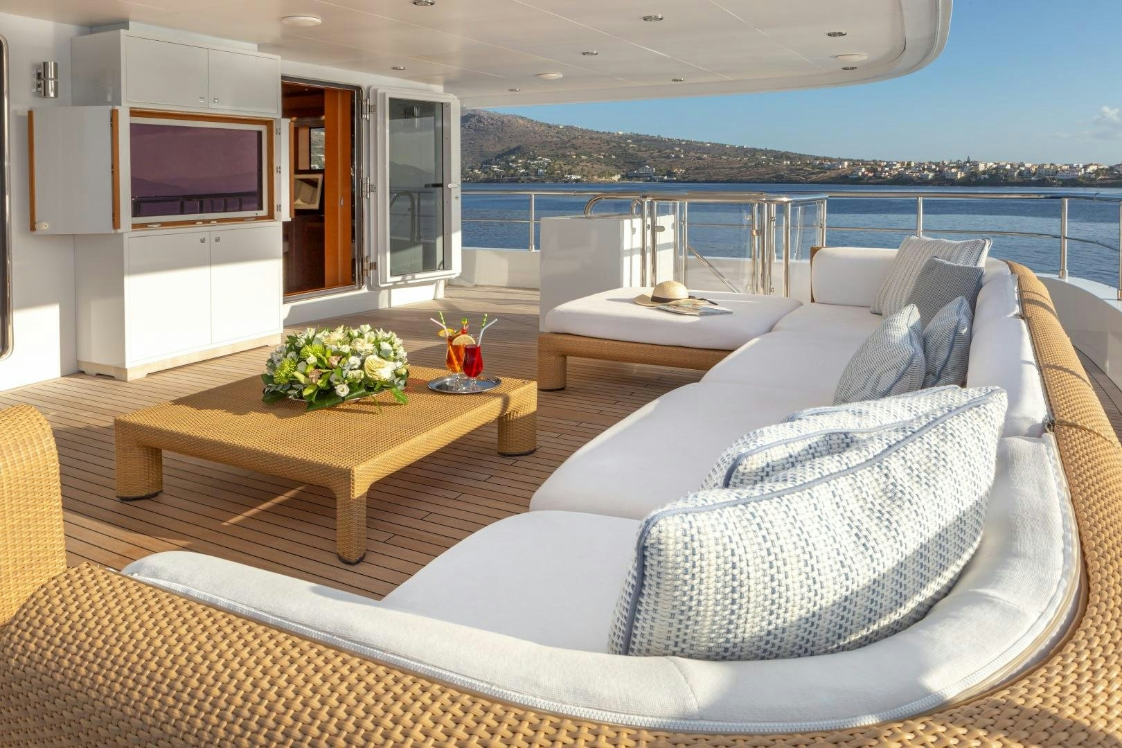 a living room with a large balcony aboard ZALIV III Yacht for Sale