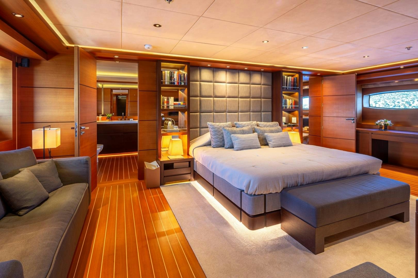 a room with a bed and a couch aboard ZALIV III Yacht for Sale