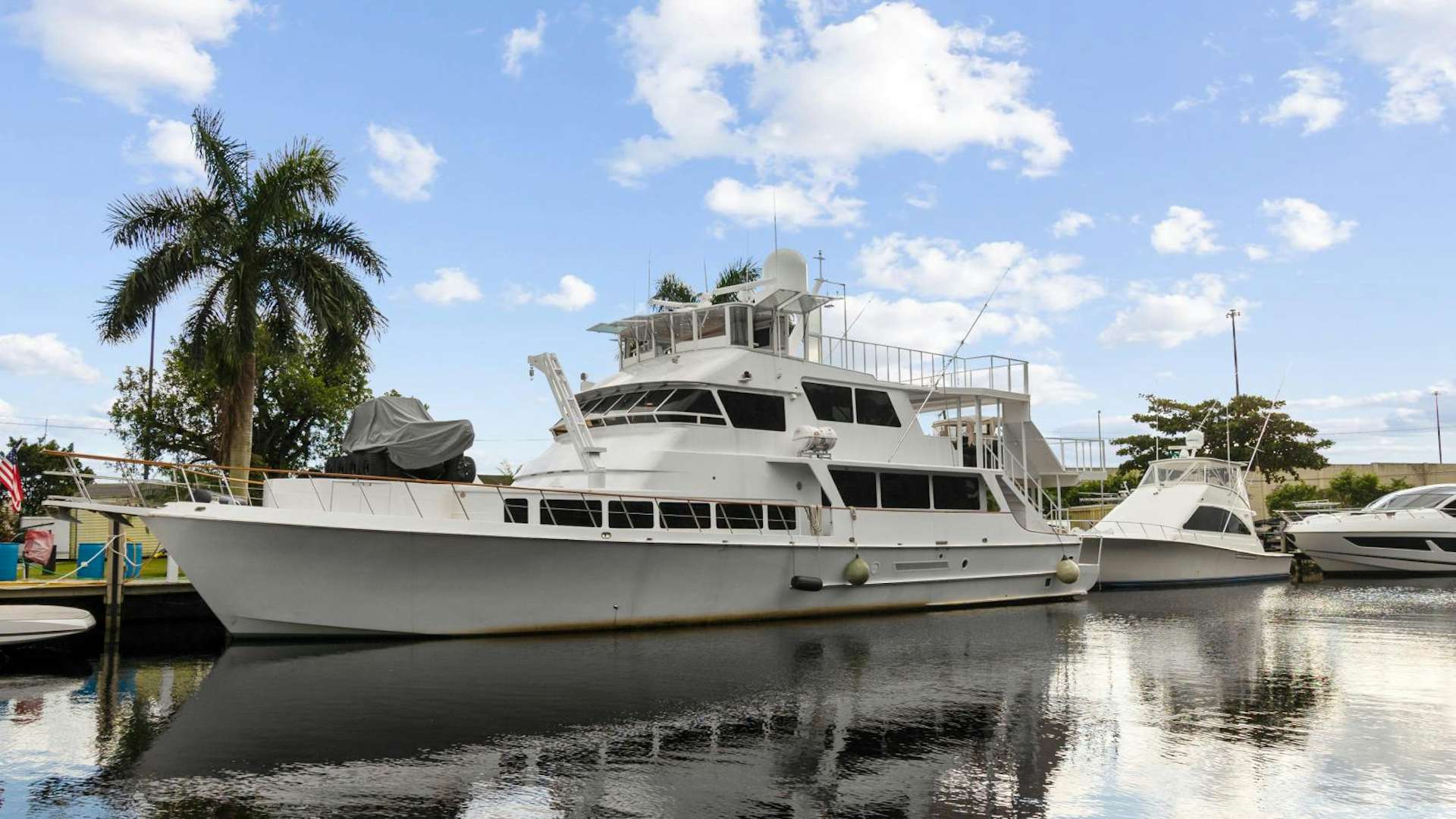 a couple of boats are parked in a harbor aboard TORTUGA Yacht for Sale