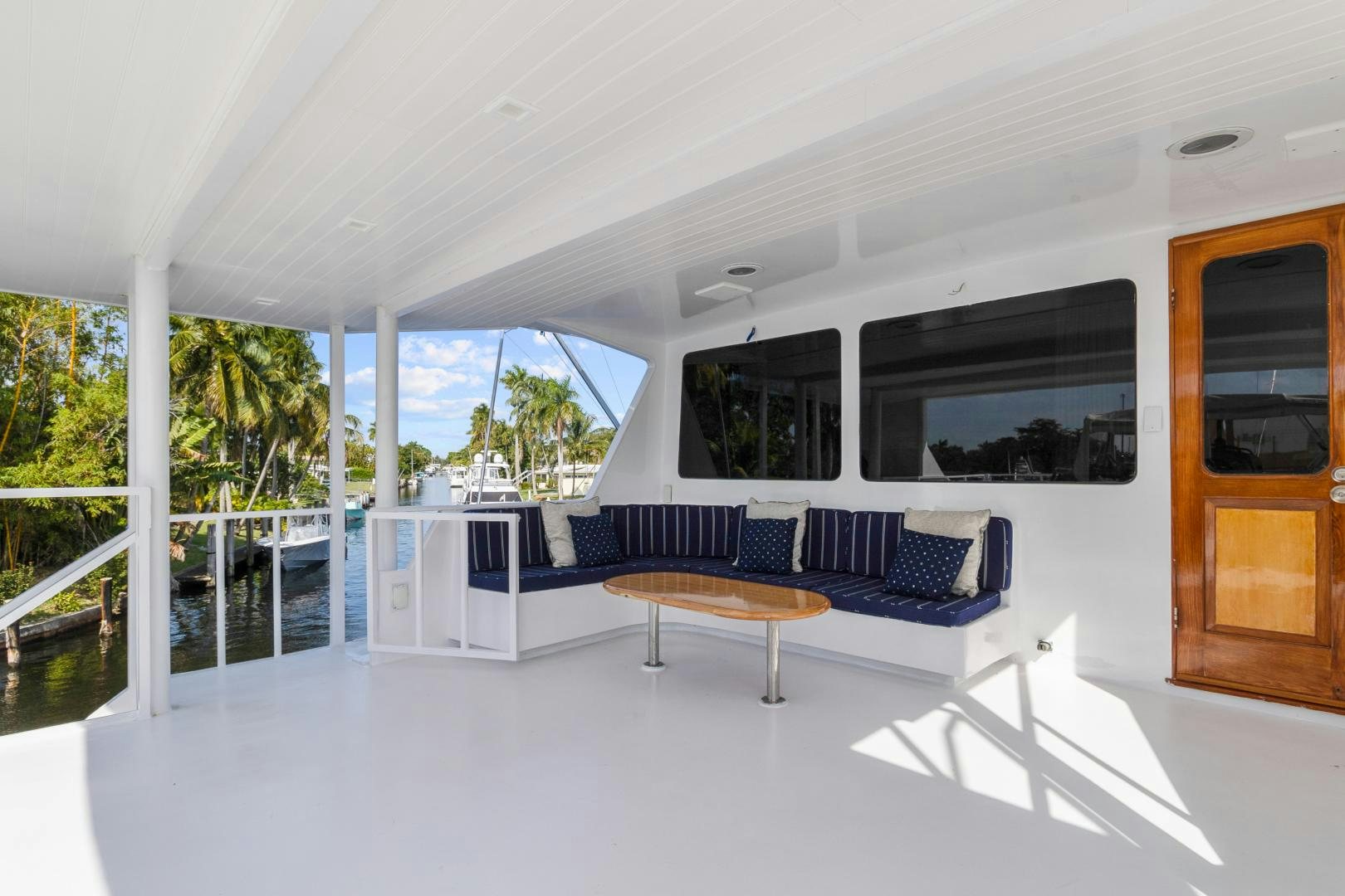 a large living room with a pool aboard MOVIE SET Yacht for Sale