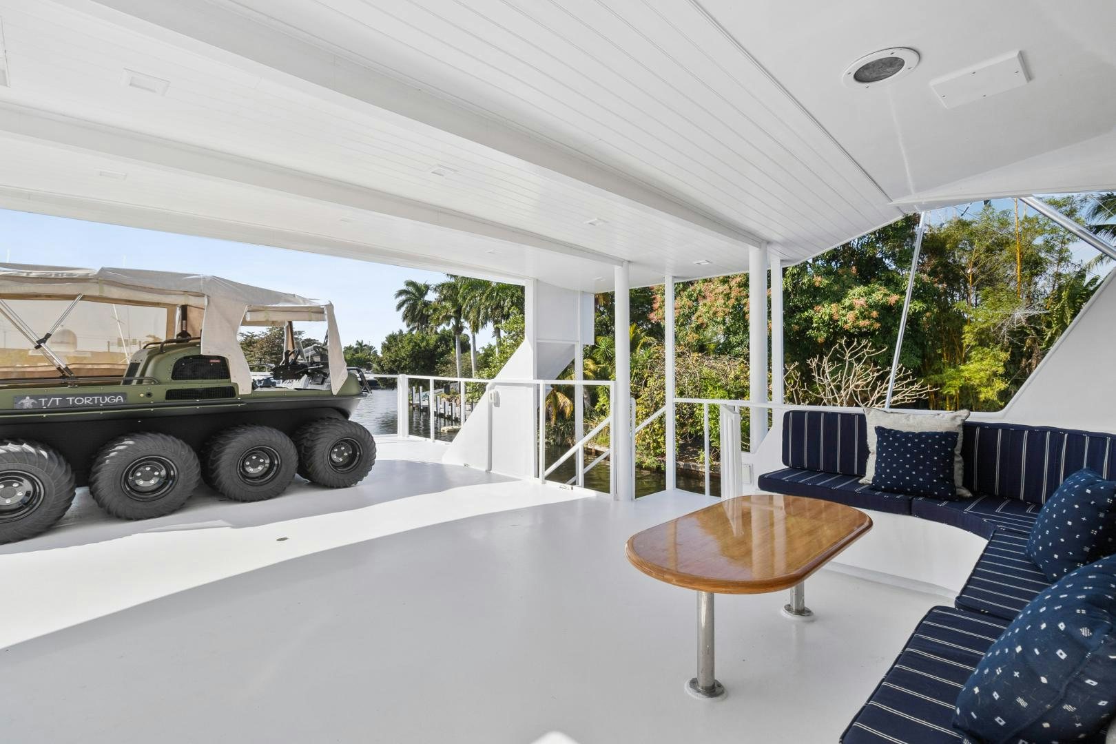 a large white and blue room with a car parked in it aboard MOVIE SET Yacht for Sale