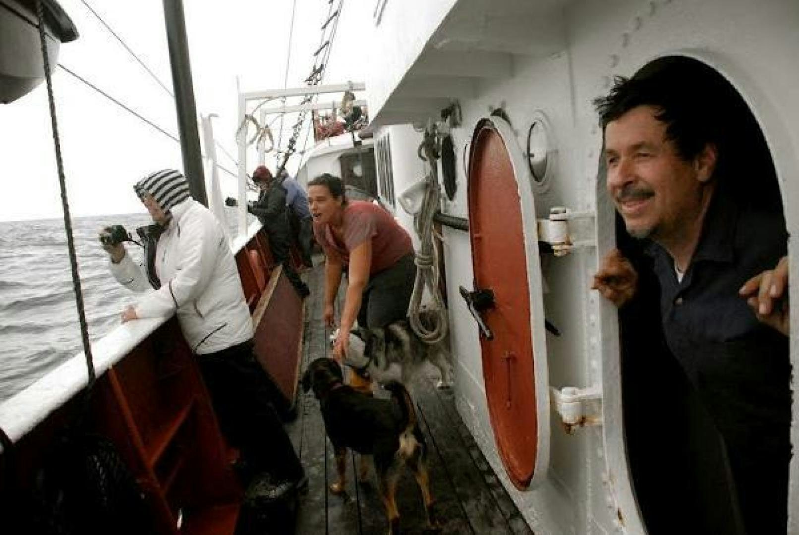 a man standing on a boat aboard WANDERBIRD Yacht for Sale