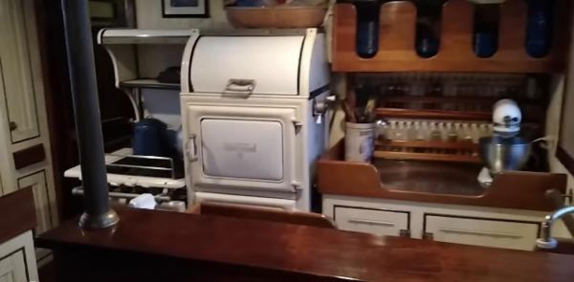 a kitchen with a microwave oven aboard WANDERBIRD Yacht for Sale