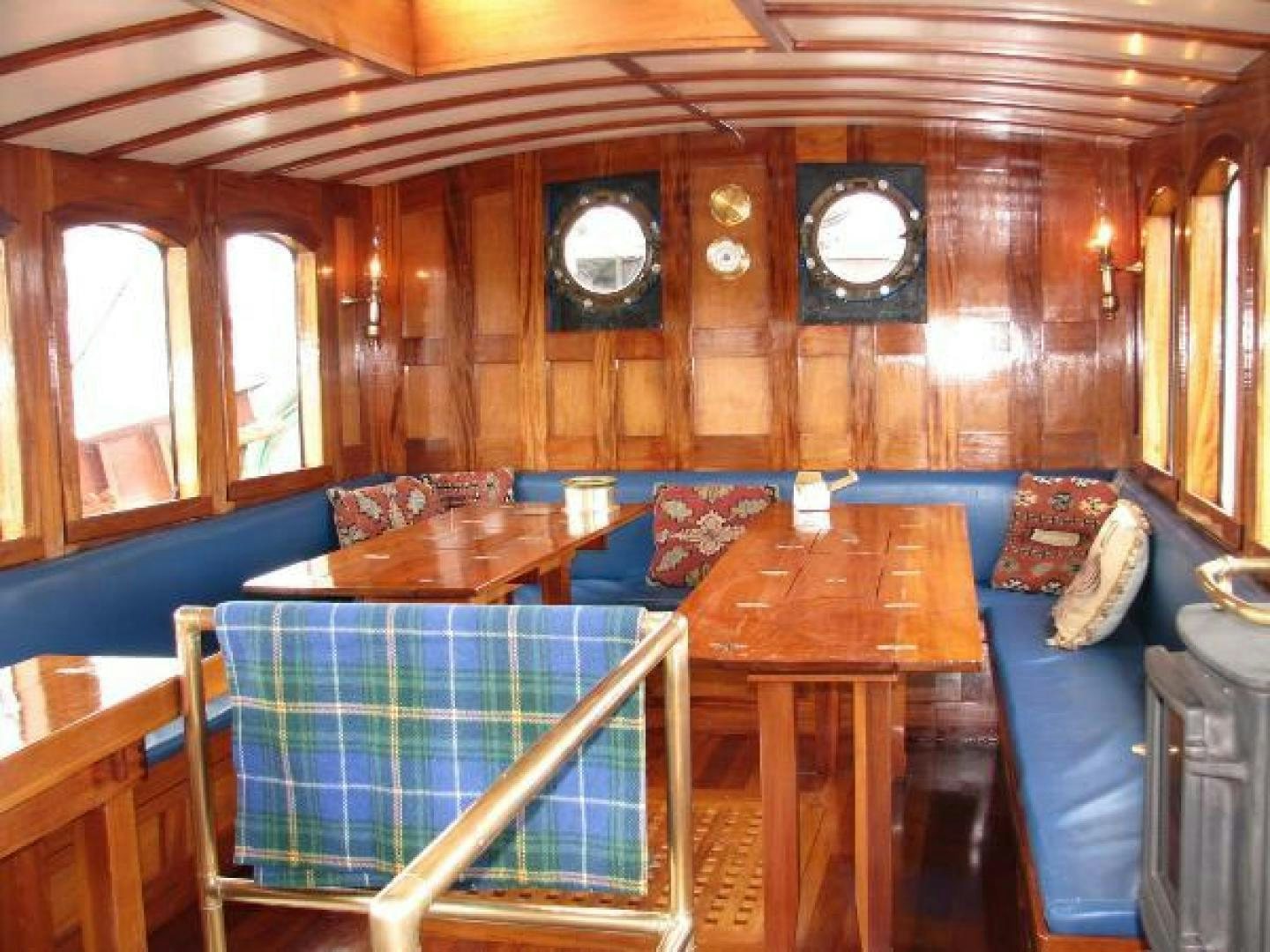 a room with a table and chairs aboard WANDERBIRD Yacht for Sale