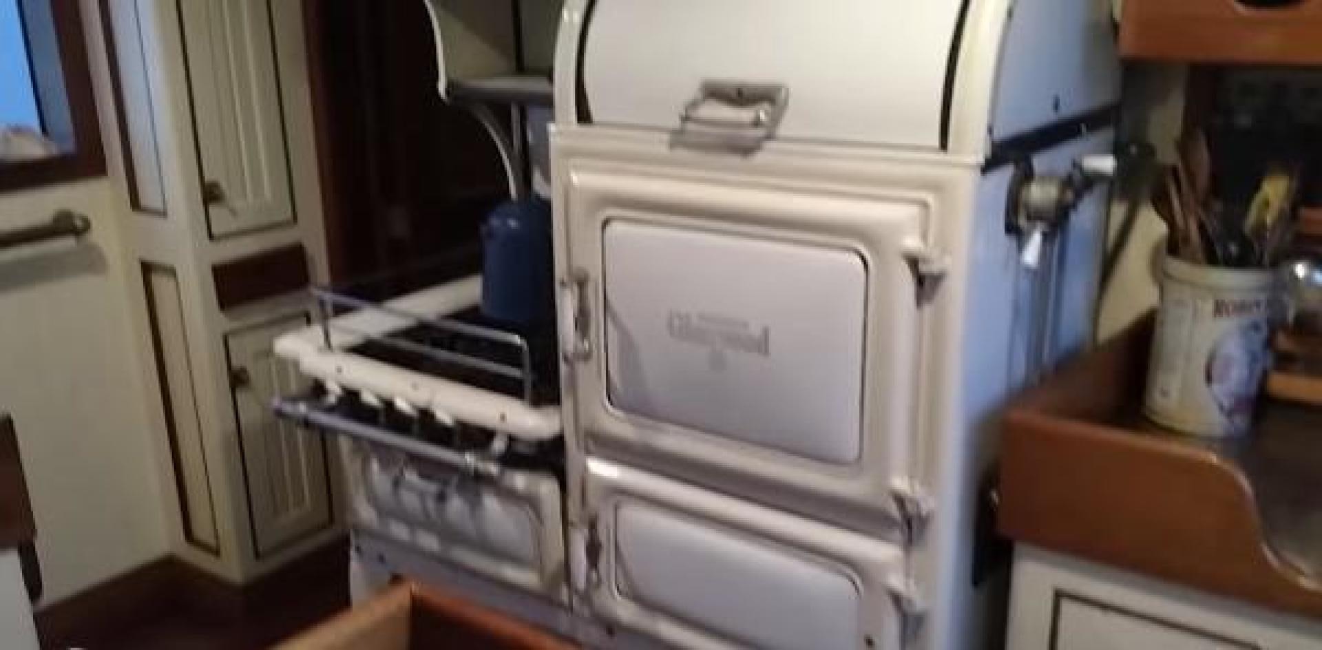 a kitchen with a white microwave aboard WANDERBIRD Yacht for Sale