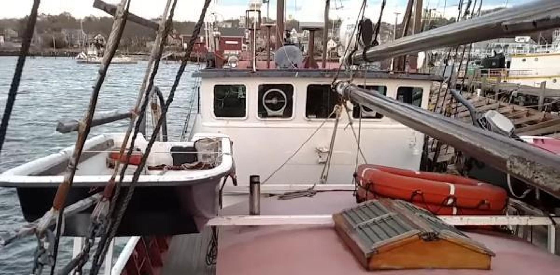 a boat docked at a pier aboard WANDERBIRD Yacht for Sale