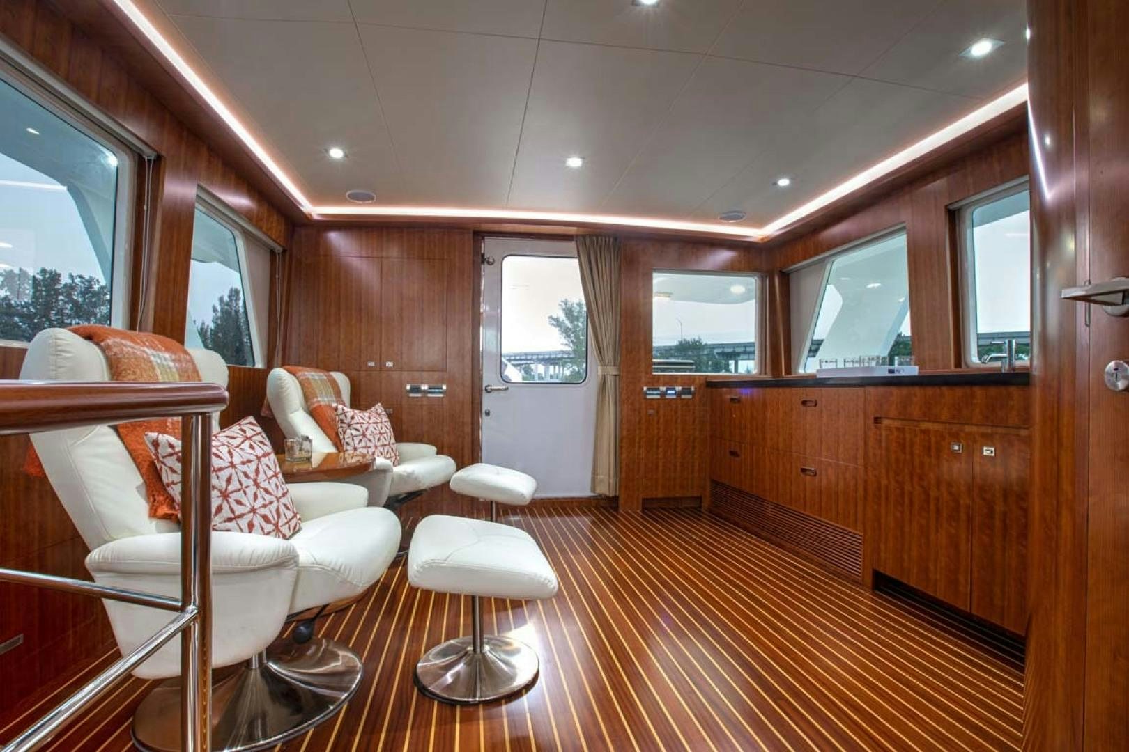a room with a wood paneled wall and a wood paneled door aboard LORETTA Yacht for Sale