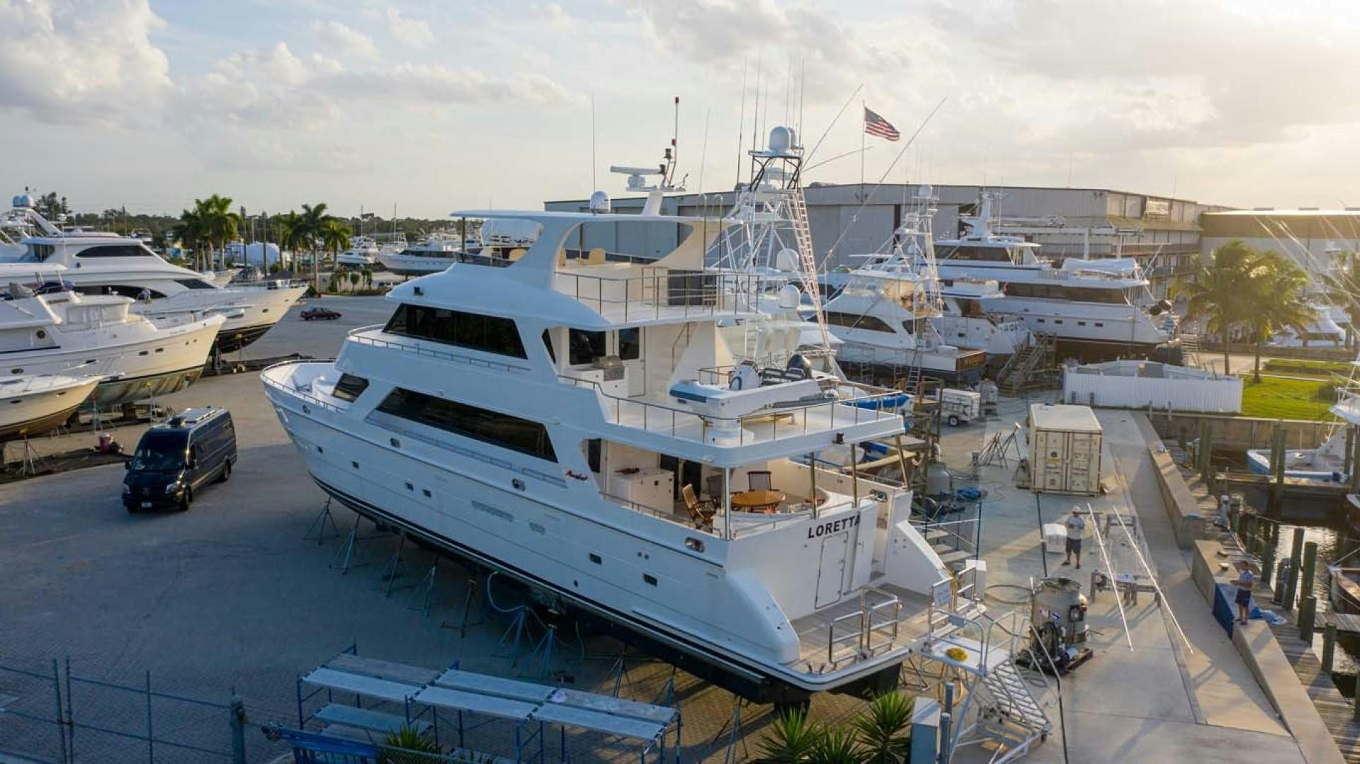 a large white boat docked aboard LORETTA Yacht for Sale