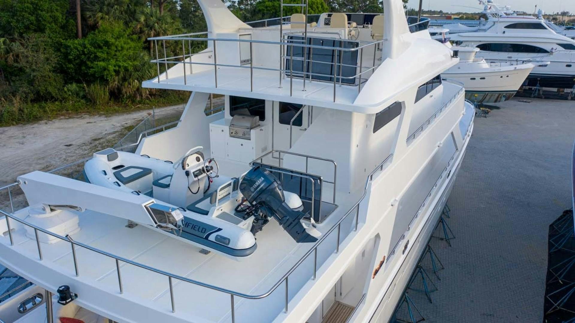 a white boat with a white boat on it aboard LORETTA Yacht for Sale