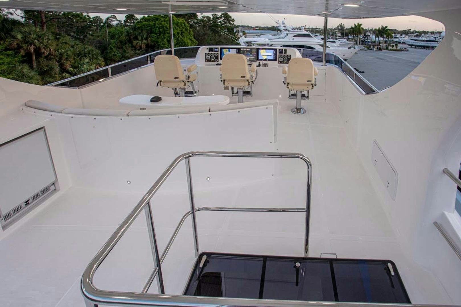 a white boat with chairs on it aboard LORETTA Yacht for Sale