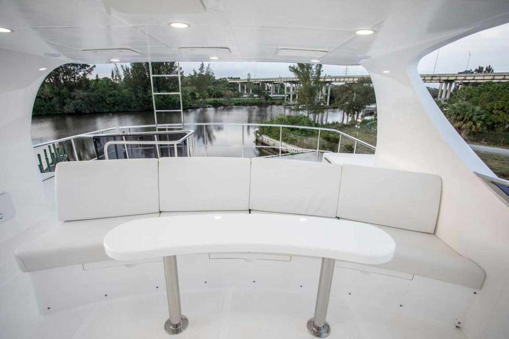 a white lounge chair next to a pool aboard LORETTA Yacht for Sale