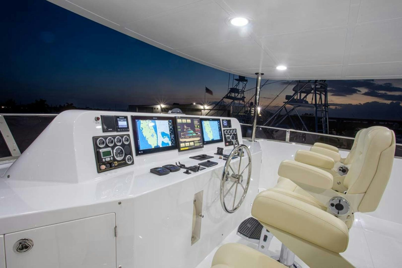 a room with a large white machine and a computer monitor aboard LORETTA Yacht for Sale