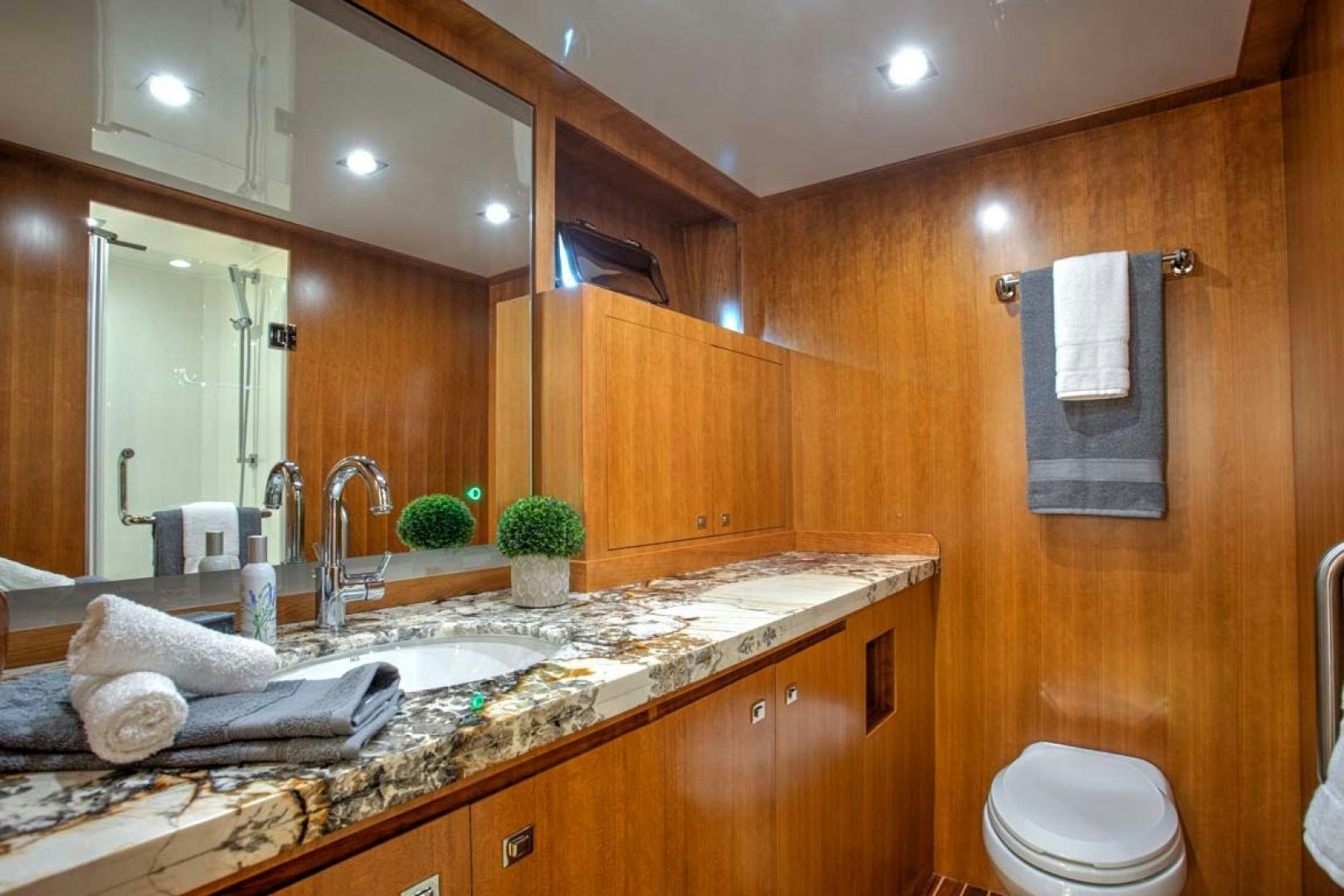 a bathroom with a large mirror aboard LORETTA Yacht for Sale