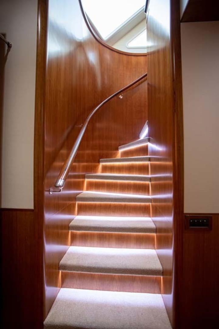 a staircase with a glass door aboard LORETTA Yacht for Sale