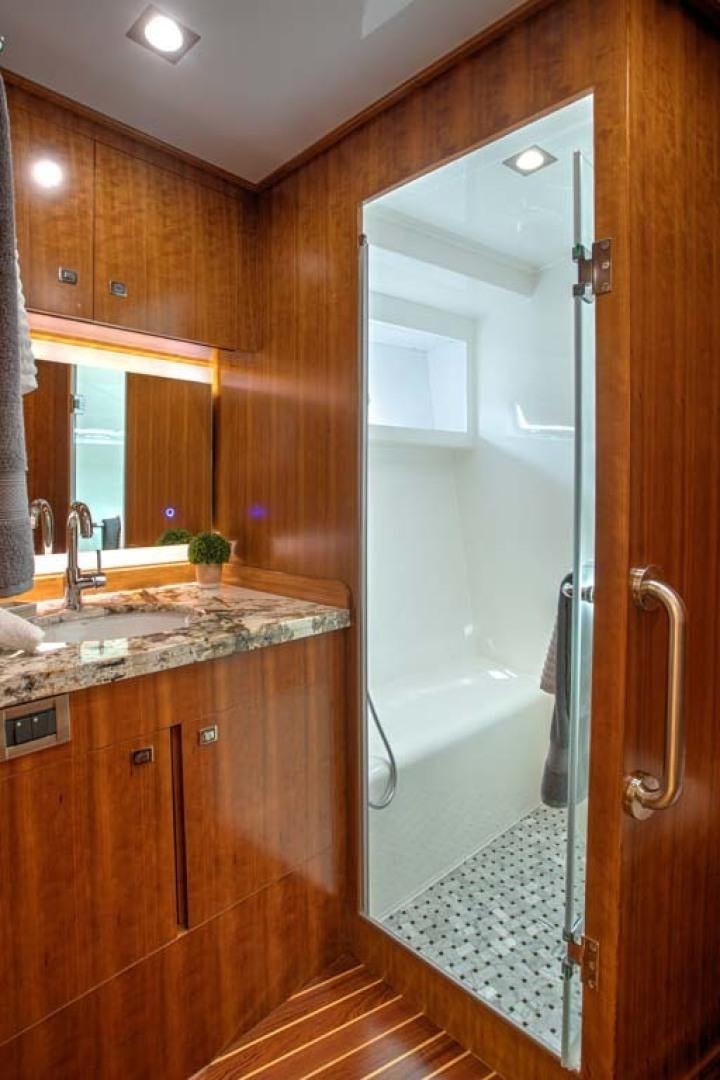 a bathroom with a glass shower aboard LORETTA Yacht for Sale