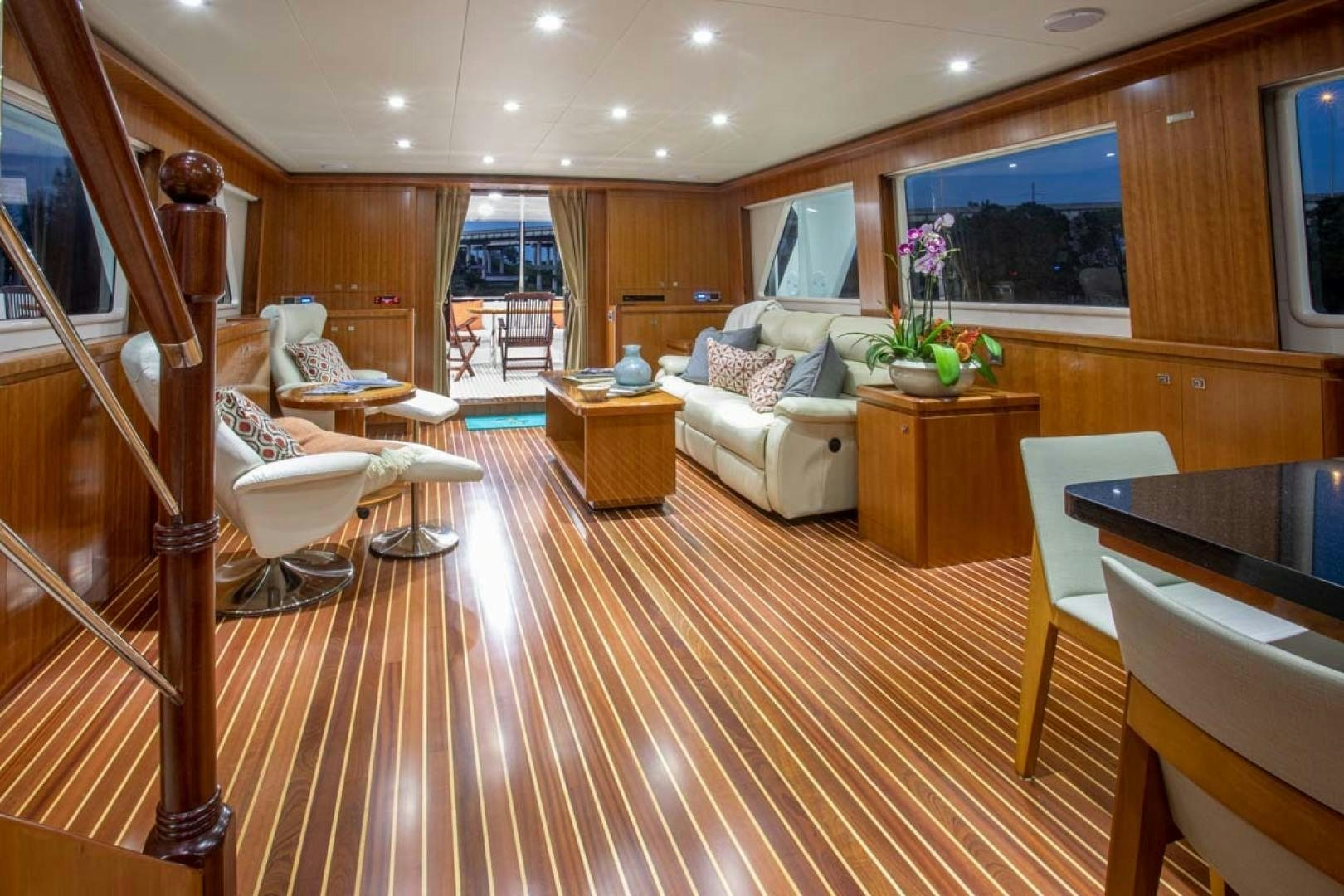 a living room with a wood floor aboard LORETTA Yacht for Sale