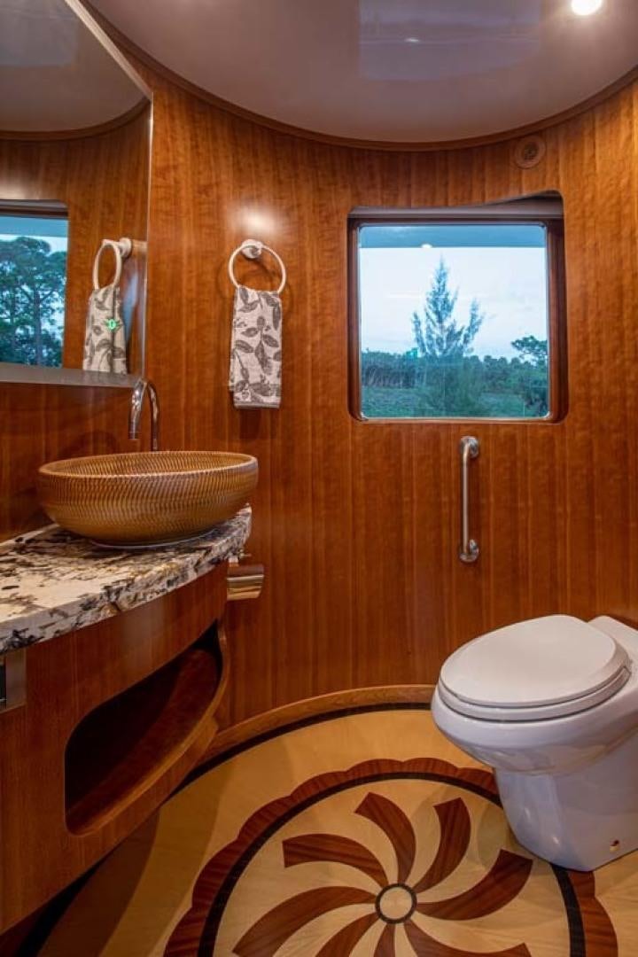 a bathroom with a sink toilet and a bathtub aboard LORETTA Yacht for Sale