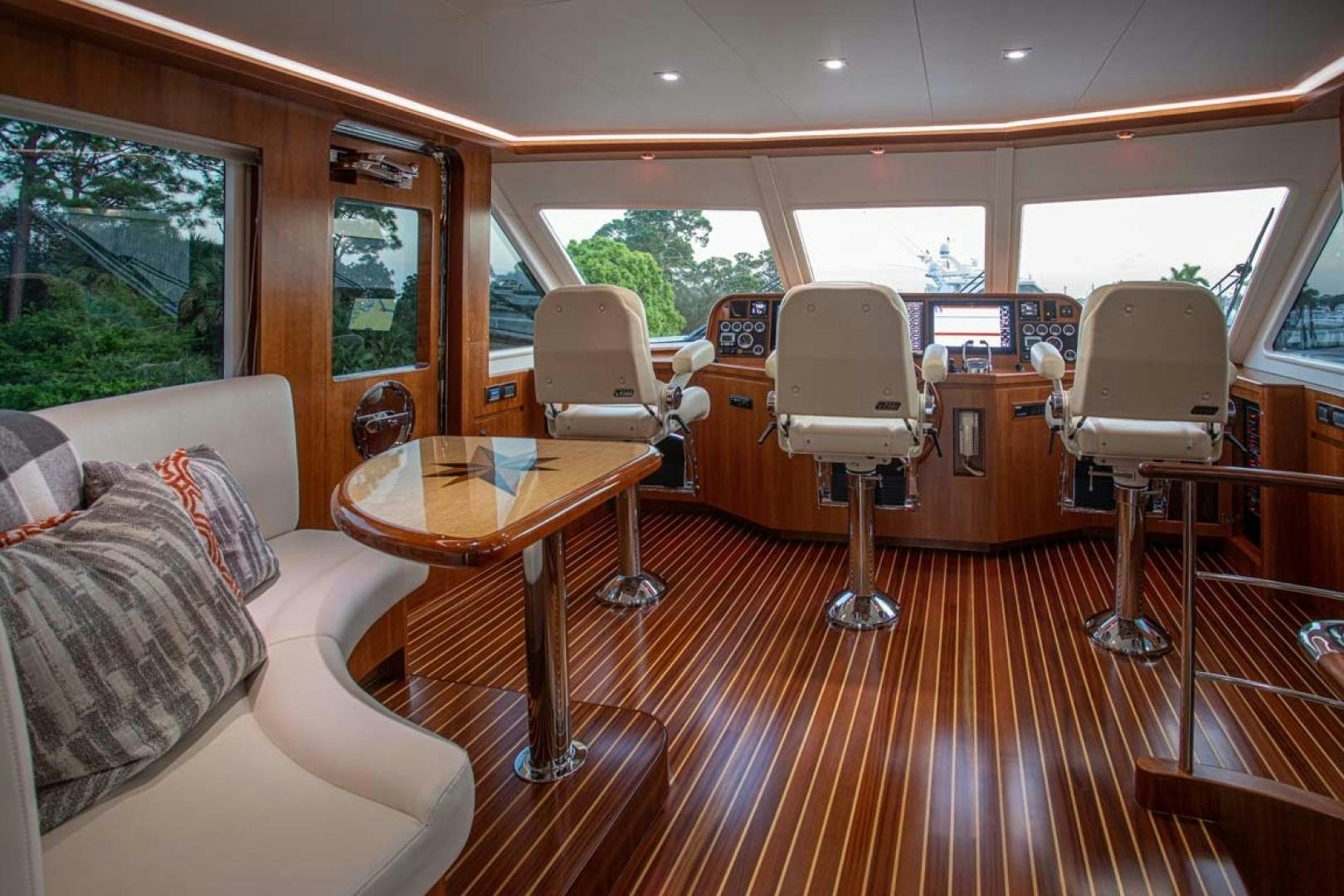 a room with a table and chairs aboard LORETTA Yacht for Sale