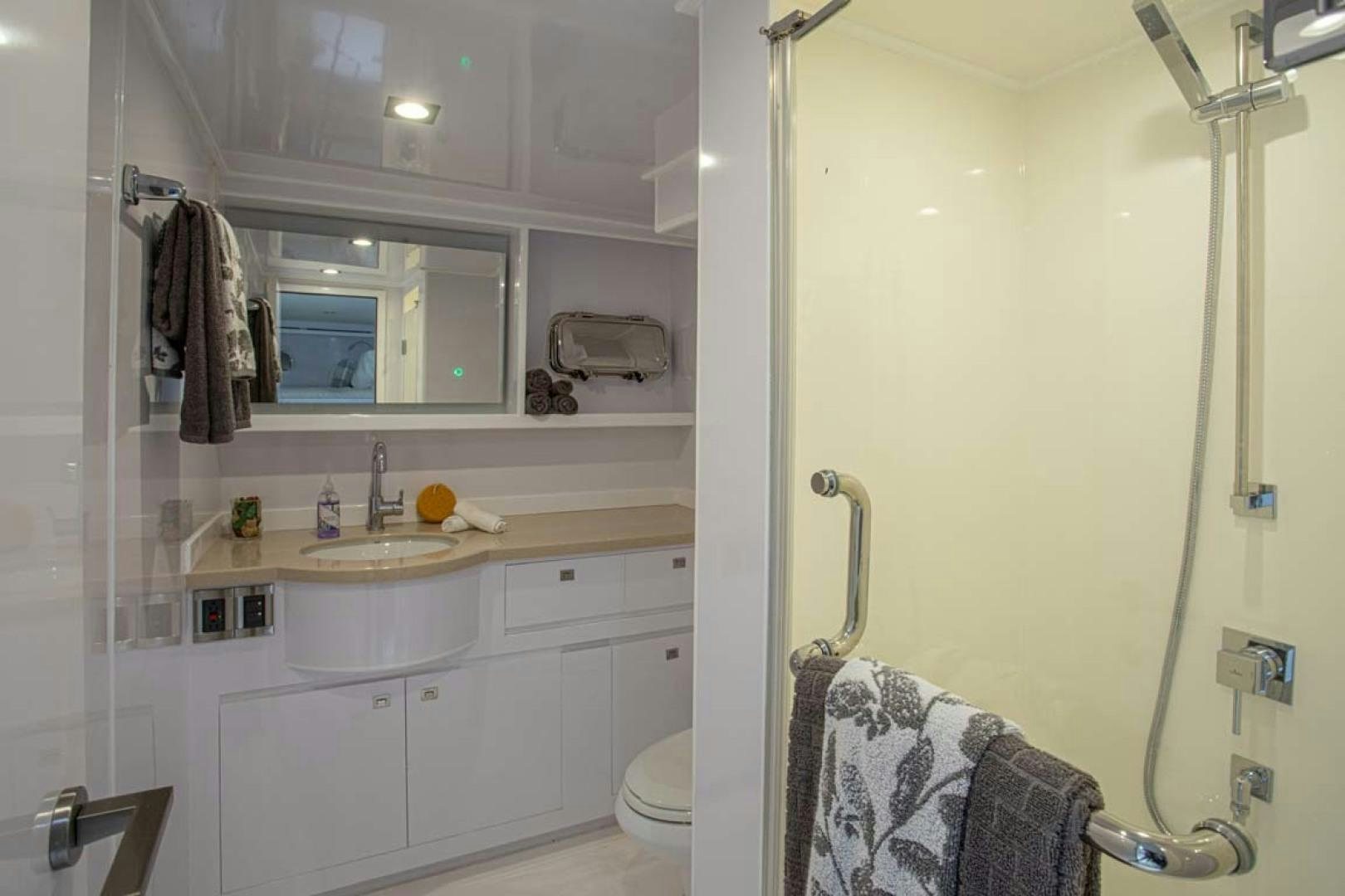 a bathroom with a sink and a mirror aboard LORETTA Yacht for Sale