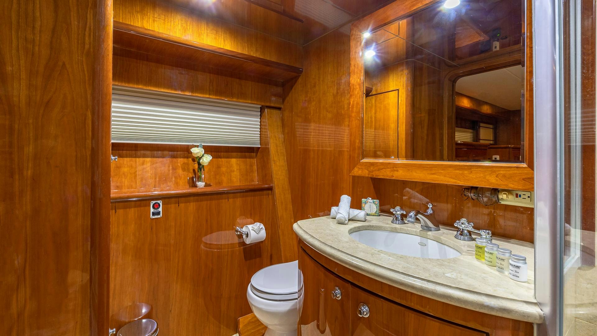a bathroom with wooden walls aboard SAFARI Yacht for Sale