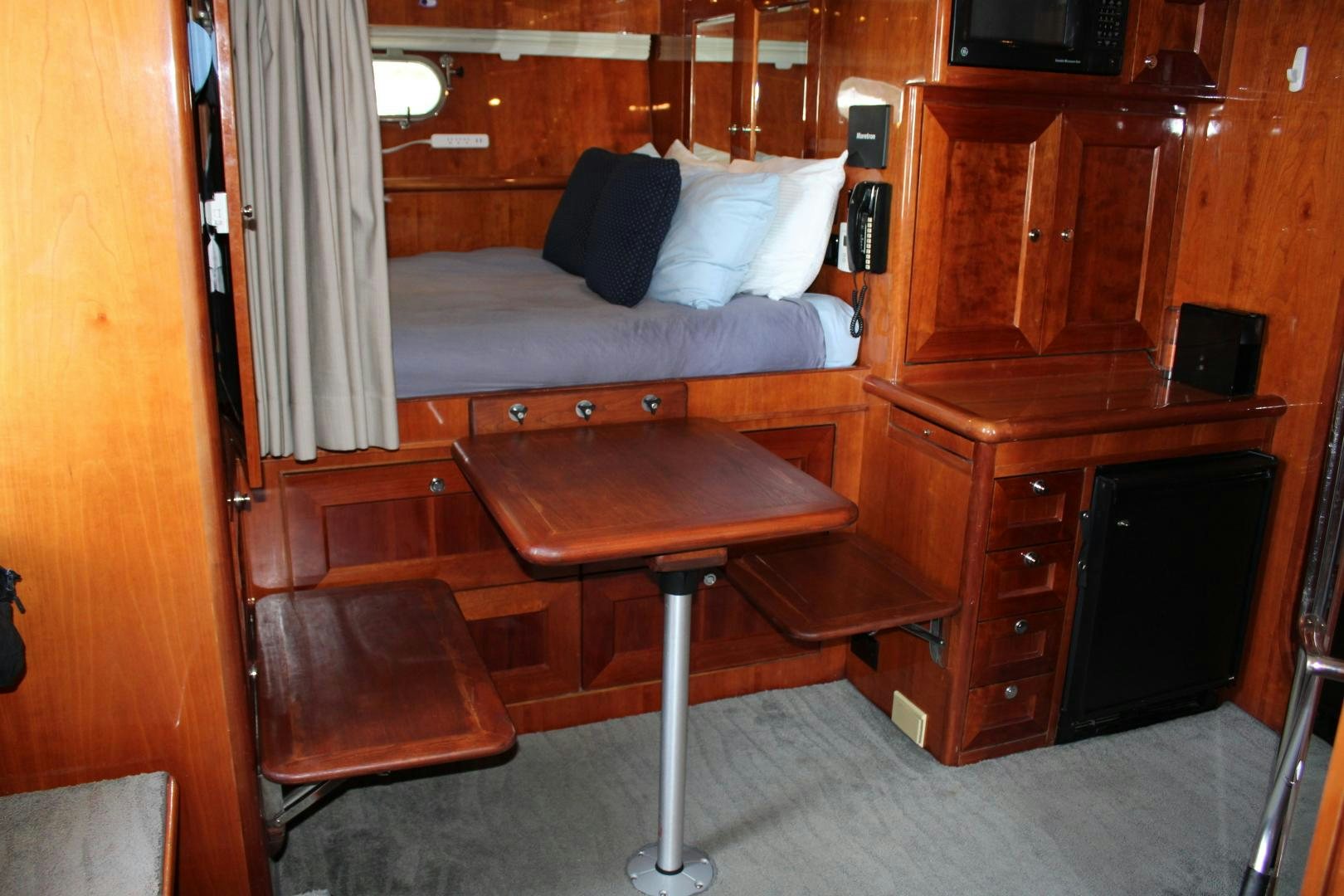 a bed and desk in a room aboard SAFARI Yacht for Sale