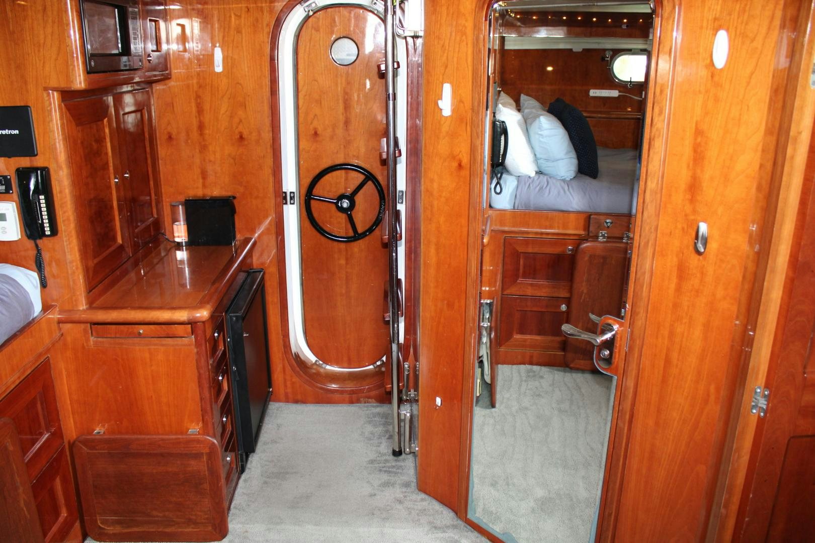a room with a bed and a desk aboard SAFARI Yacht for Sale