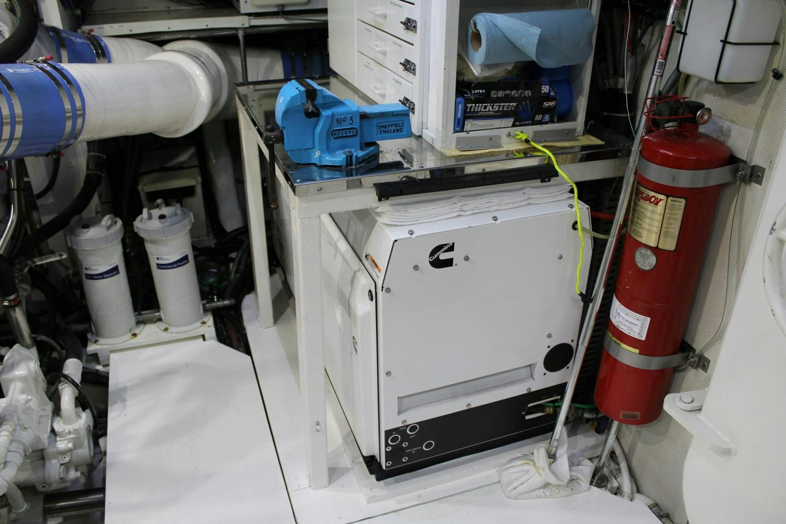 a hand holding a white device aboard SAFARI Yacht for Sale