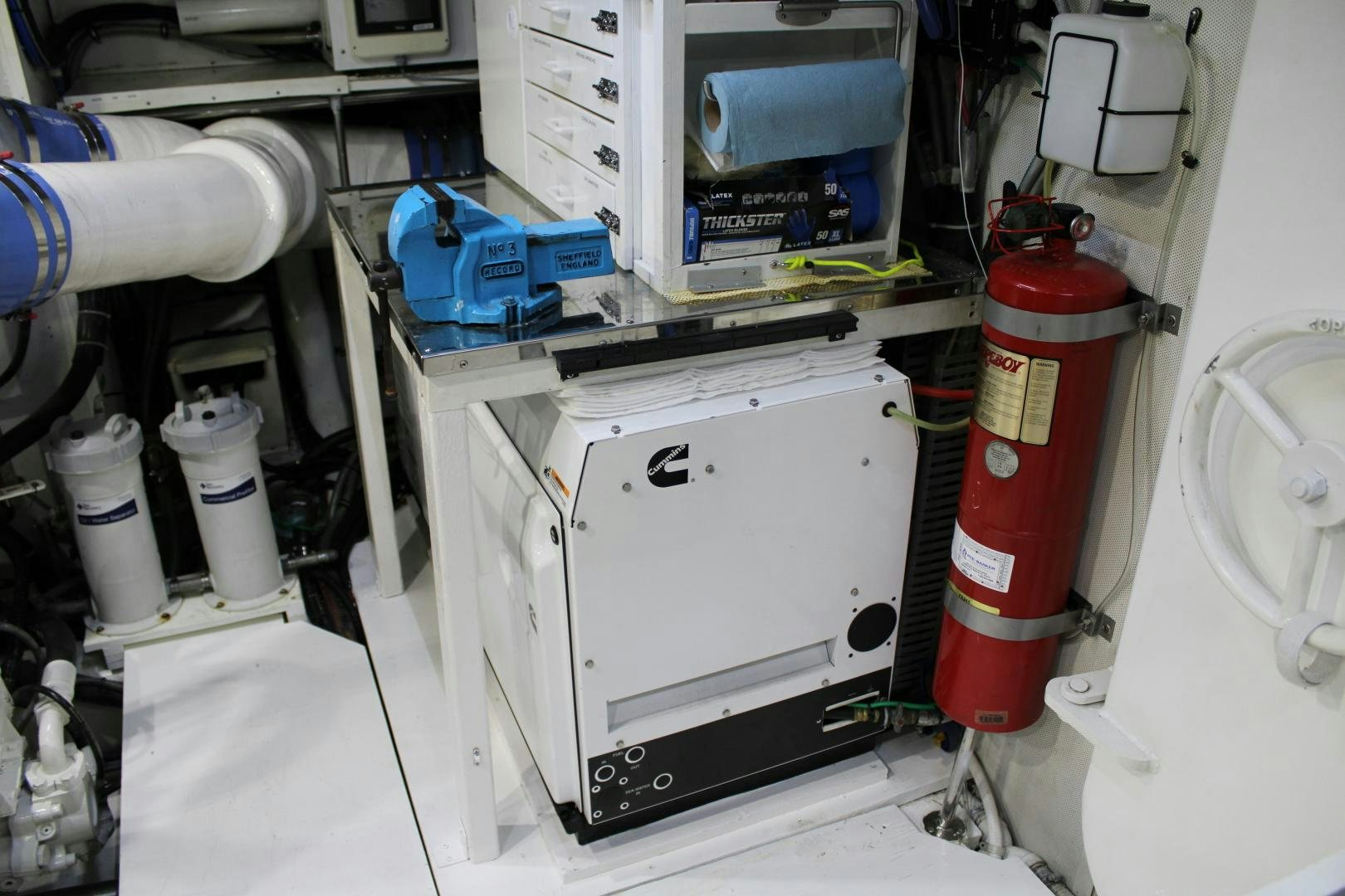 a white machine with a red label aboard SAFARI Yacht for Sale