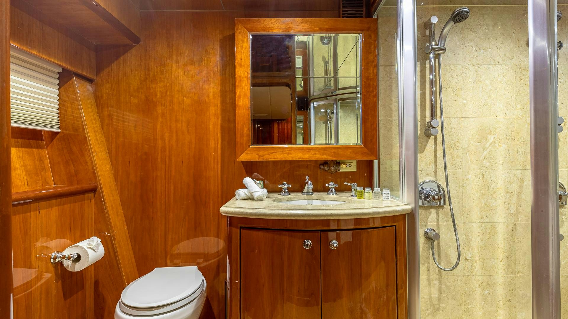 a bathroom with a sink and a toilet aboard SAFARI Yacht for Sale