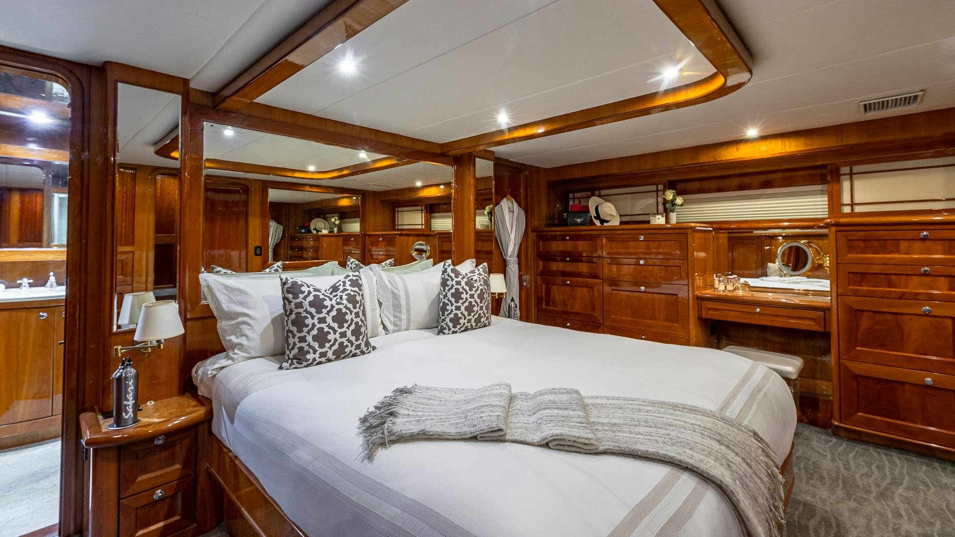 a bed with white sheets aboard SAFARI Yacht for Sale