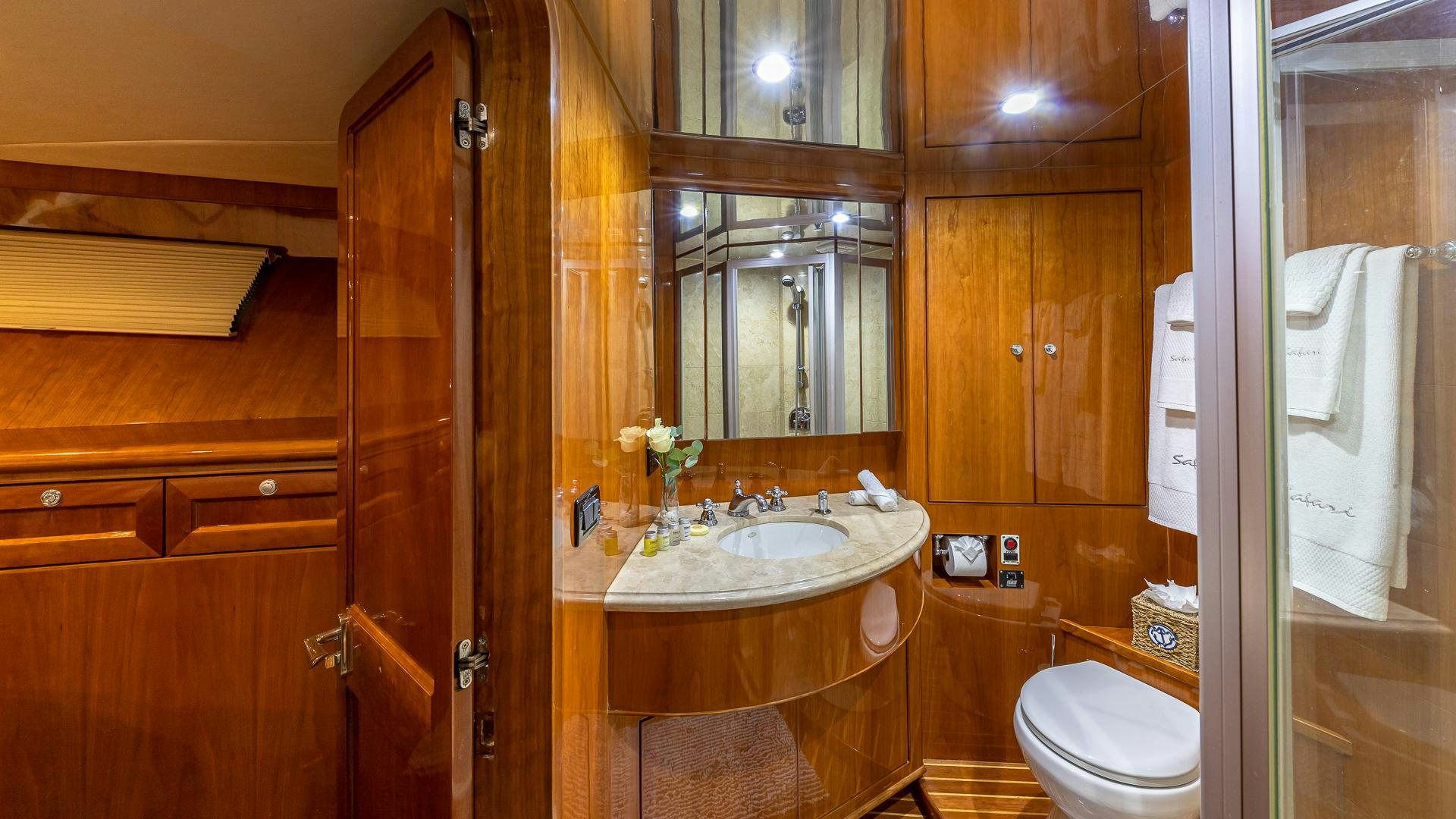 a bathroom with a sink and a mirror aboard SAFARI Yacht for Sale