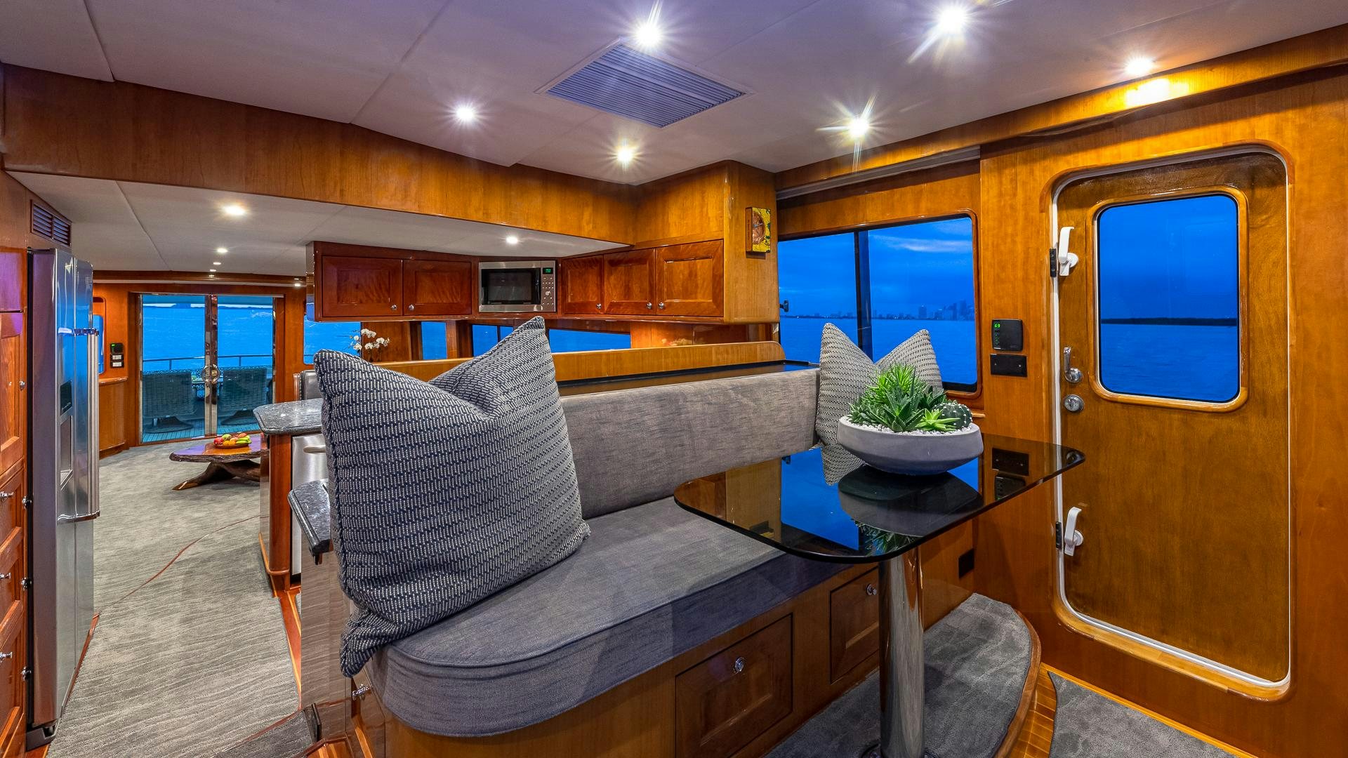 a room with a table and chairs aboard SAFARI Yacht for Sale