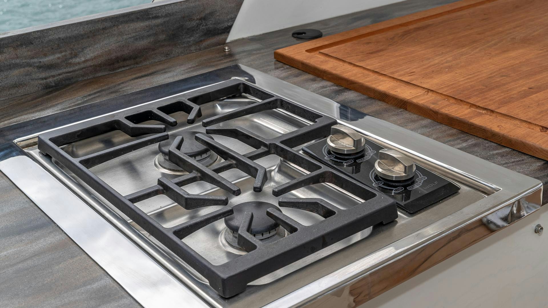 a stove top with a wood surface aboard SAFARI Yacht for Sale