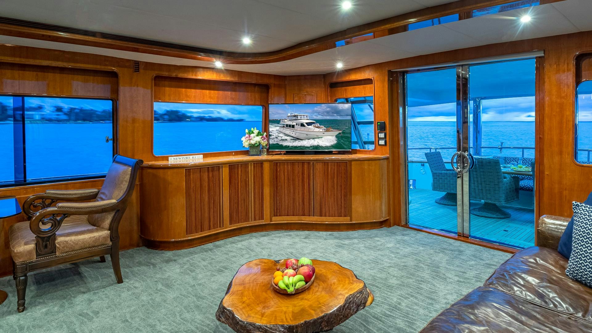 a room with a table and chairs aboard SAFARI Yacht for Sale