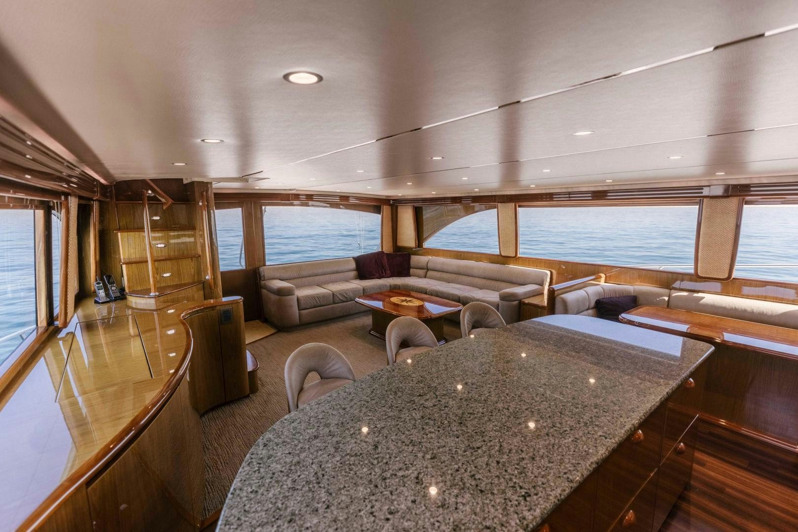 a living room with a large window aboard SALTY K Yacht for Sale