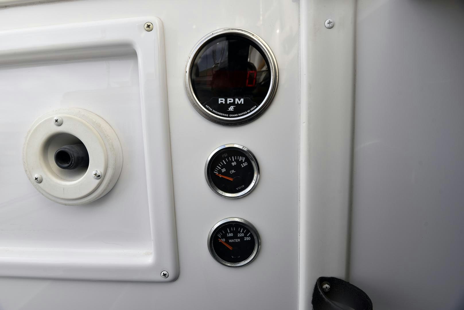 a close-up of a white car's dashboard aboard SALTY K Yacht for Sale