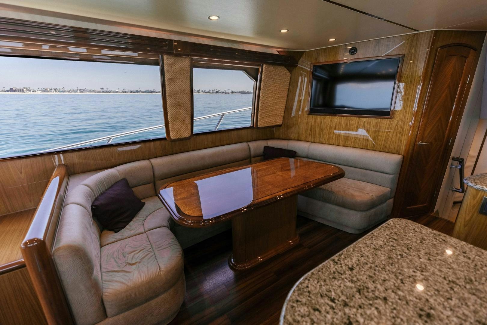 a living room with a couch and a table aboard SALTY K Yacht for Sale