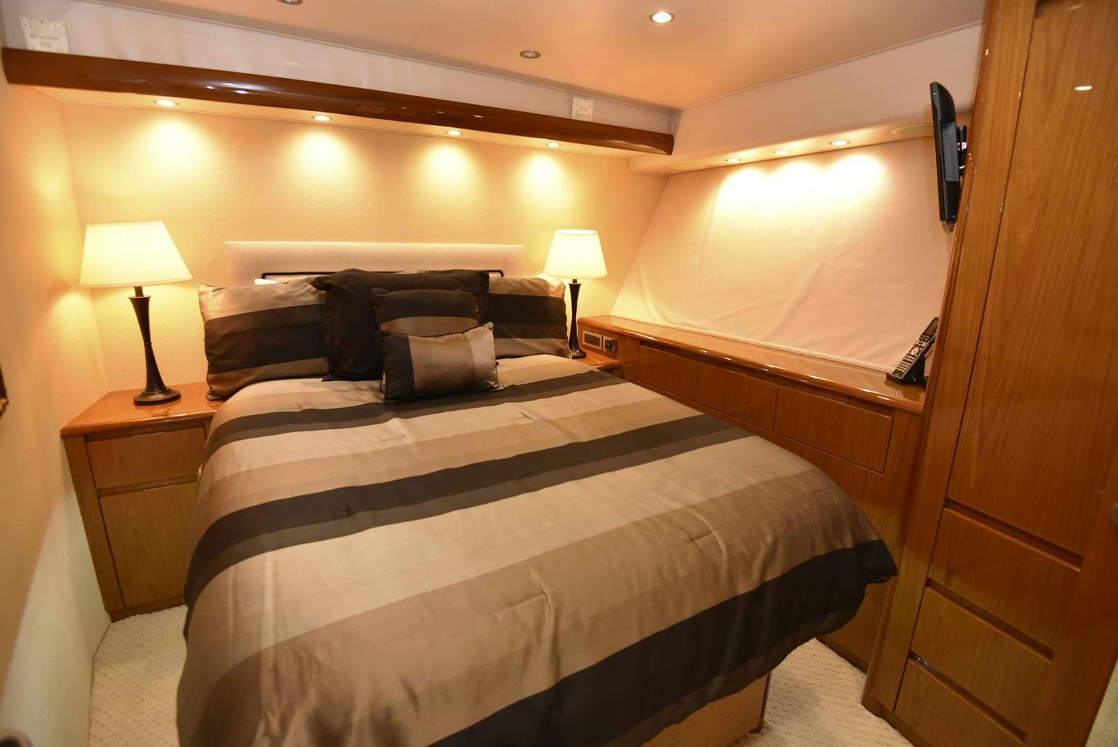 a hotel room with a bed and a desk aboard SALTY K Yacht for Sale