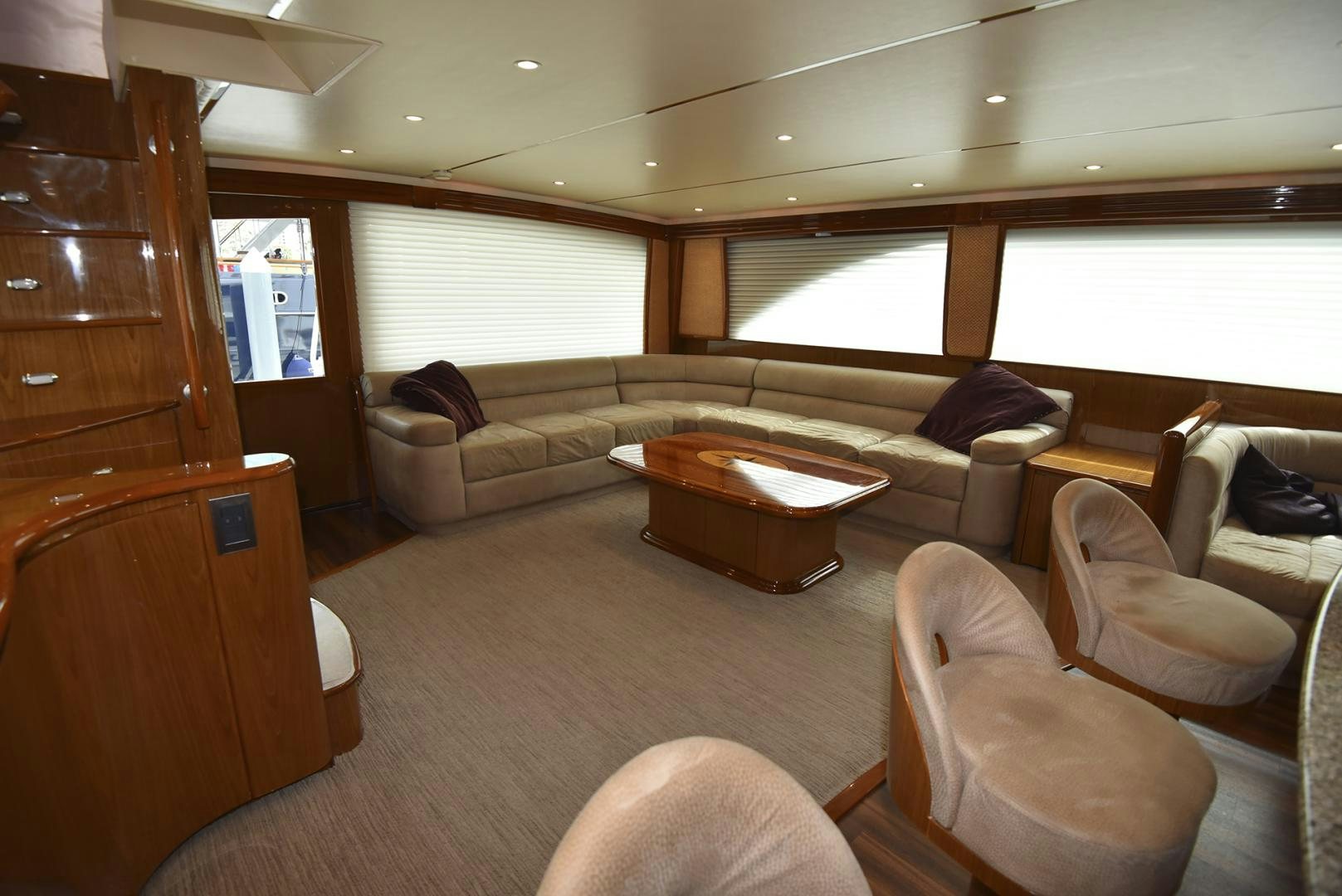 a living room with a couch and a coffee table aboard SALTY K Yacht for Sale