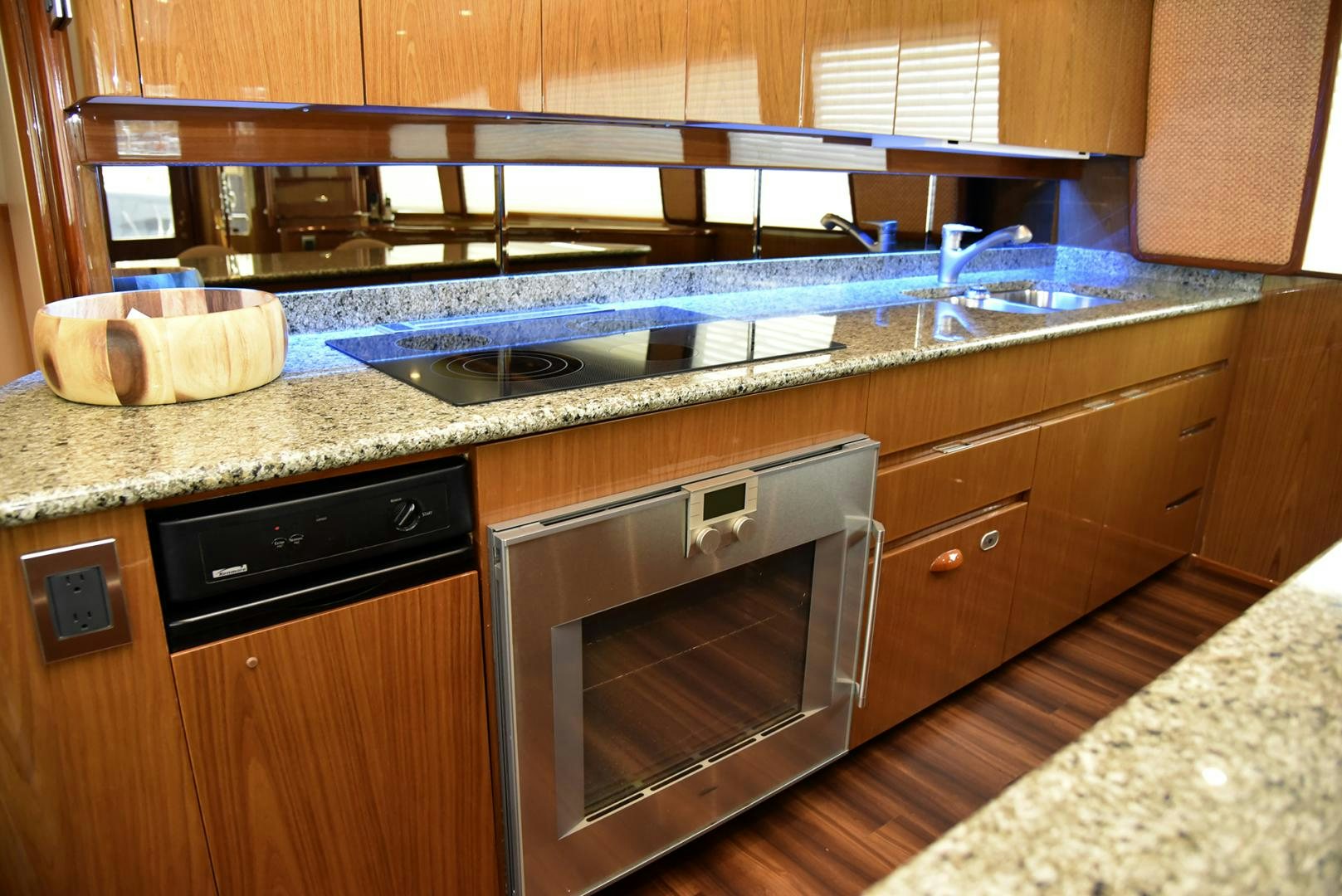 a kitchen with a stainless steel oven aboard SALTY K Yacht for Sale