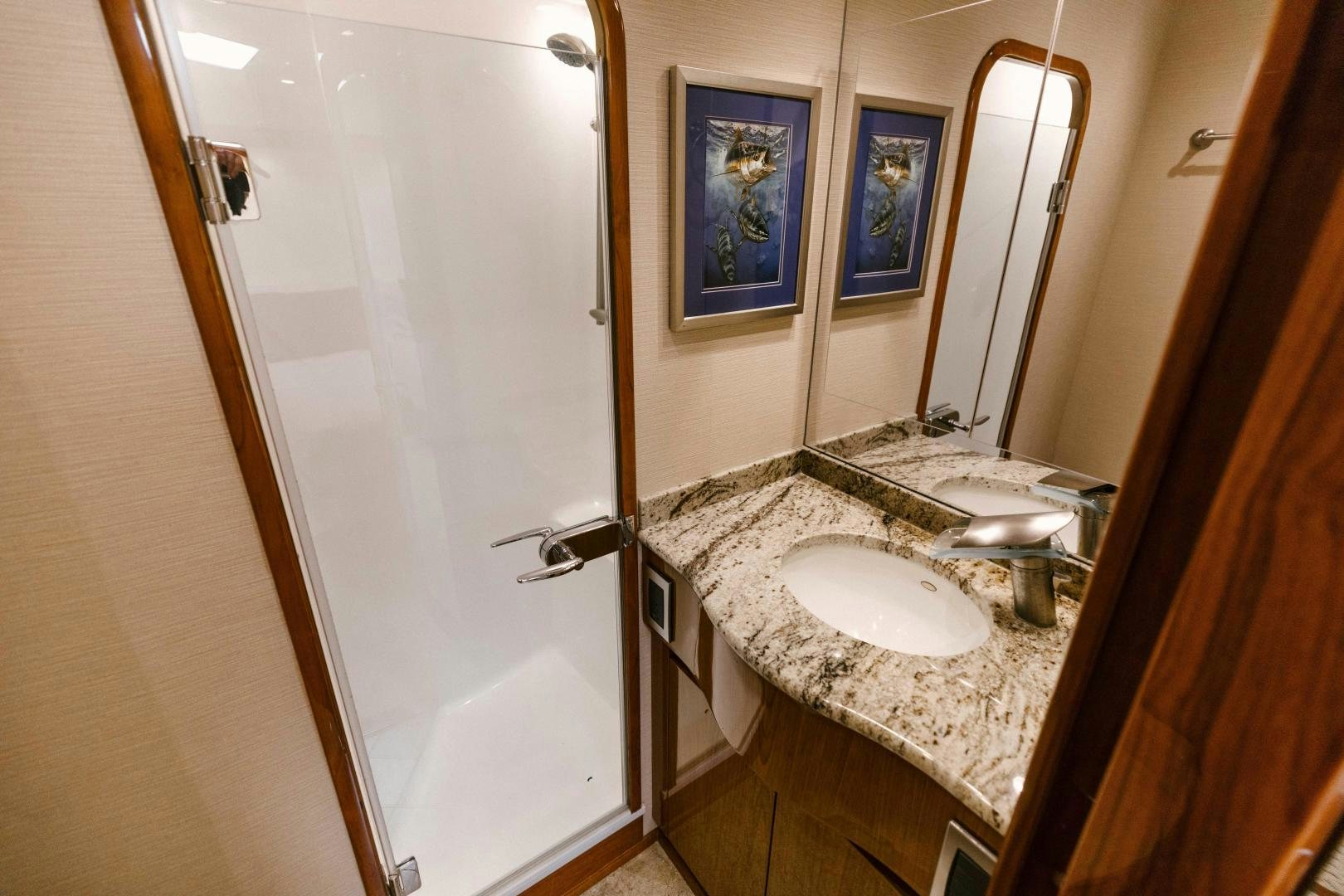 a bathroom with a sink and a mirror aboard SALTY K Yacht for Sale