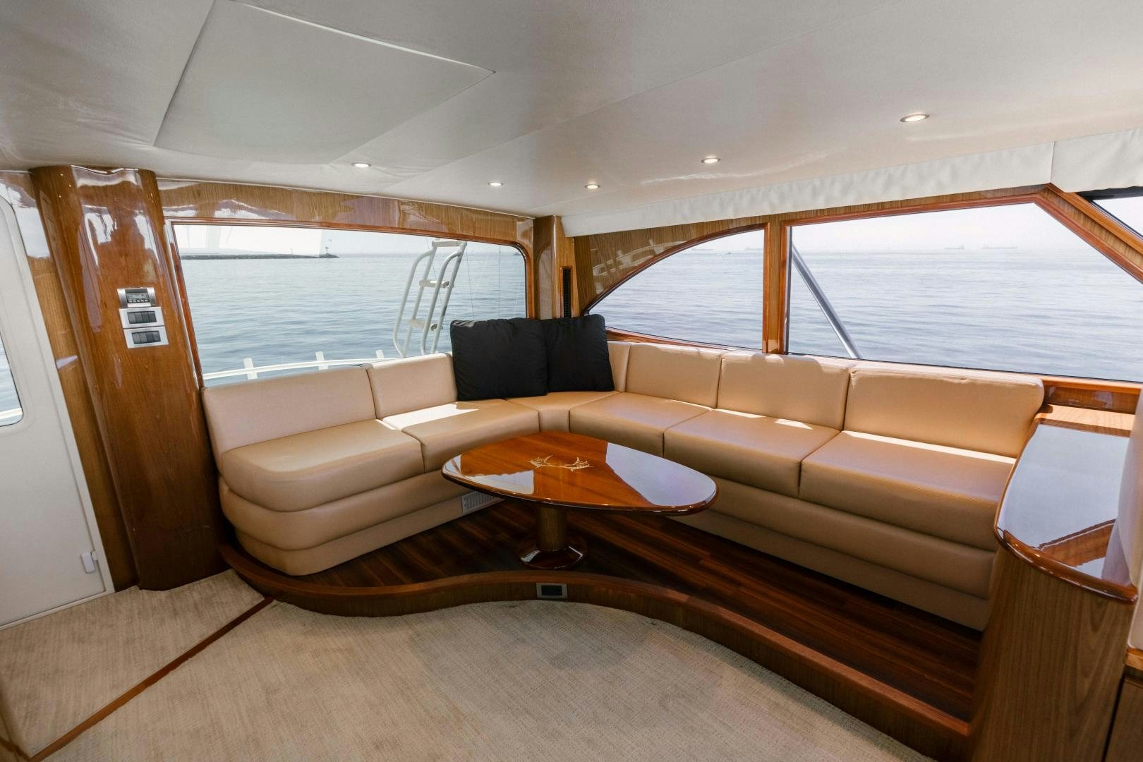 a living room with a couch and a table aboard SALTY K Yacht for Sale