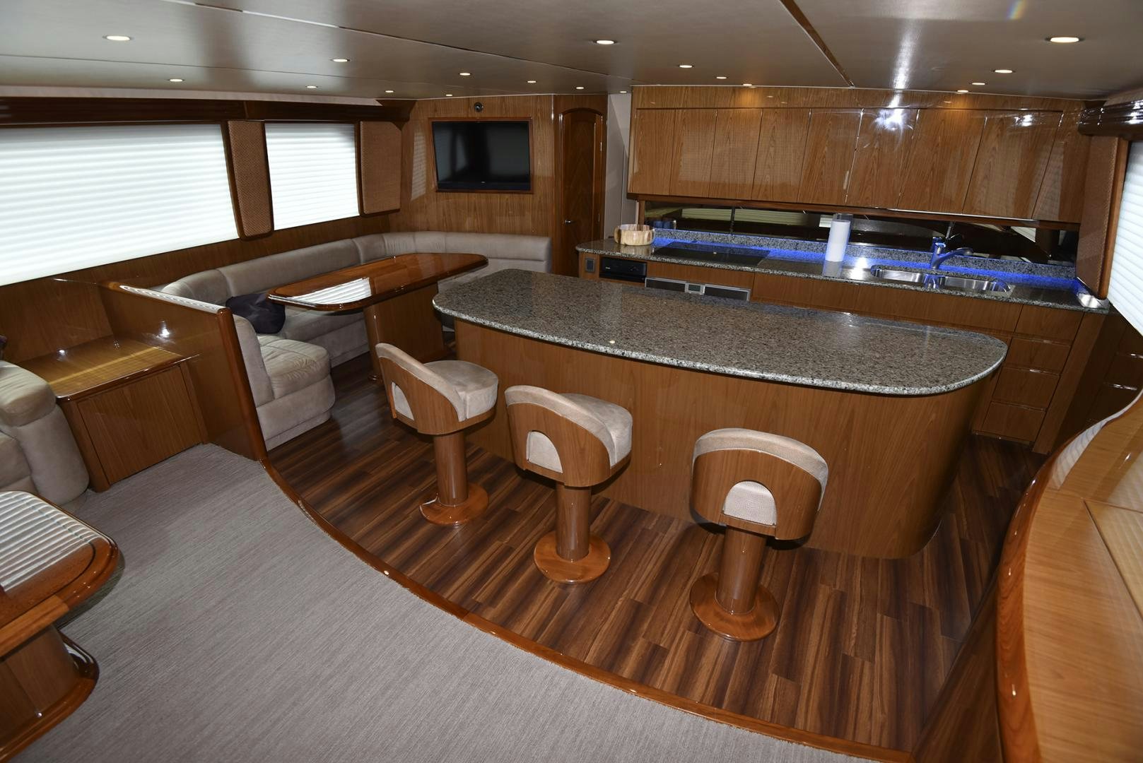 a large kitchen with a bar and seating area aboard SALTY K Yacht for Sale