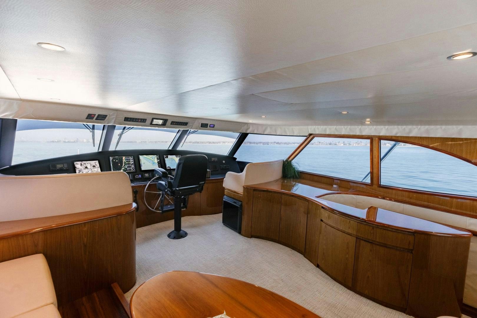 a room with a desk and chairs aboard SALTY K Yacht for Sale