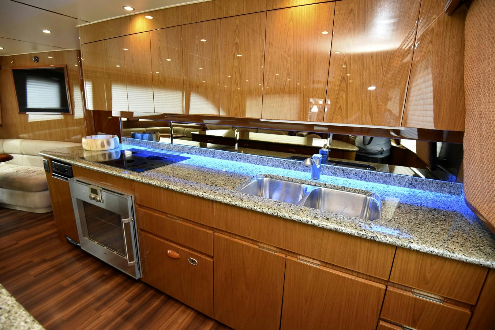 a kitchen with wooden cabinets aboard SALTY K Yacht for Sale