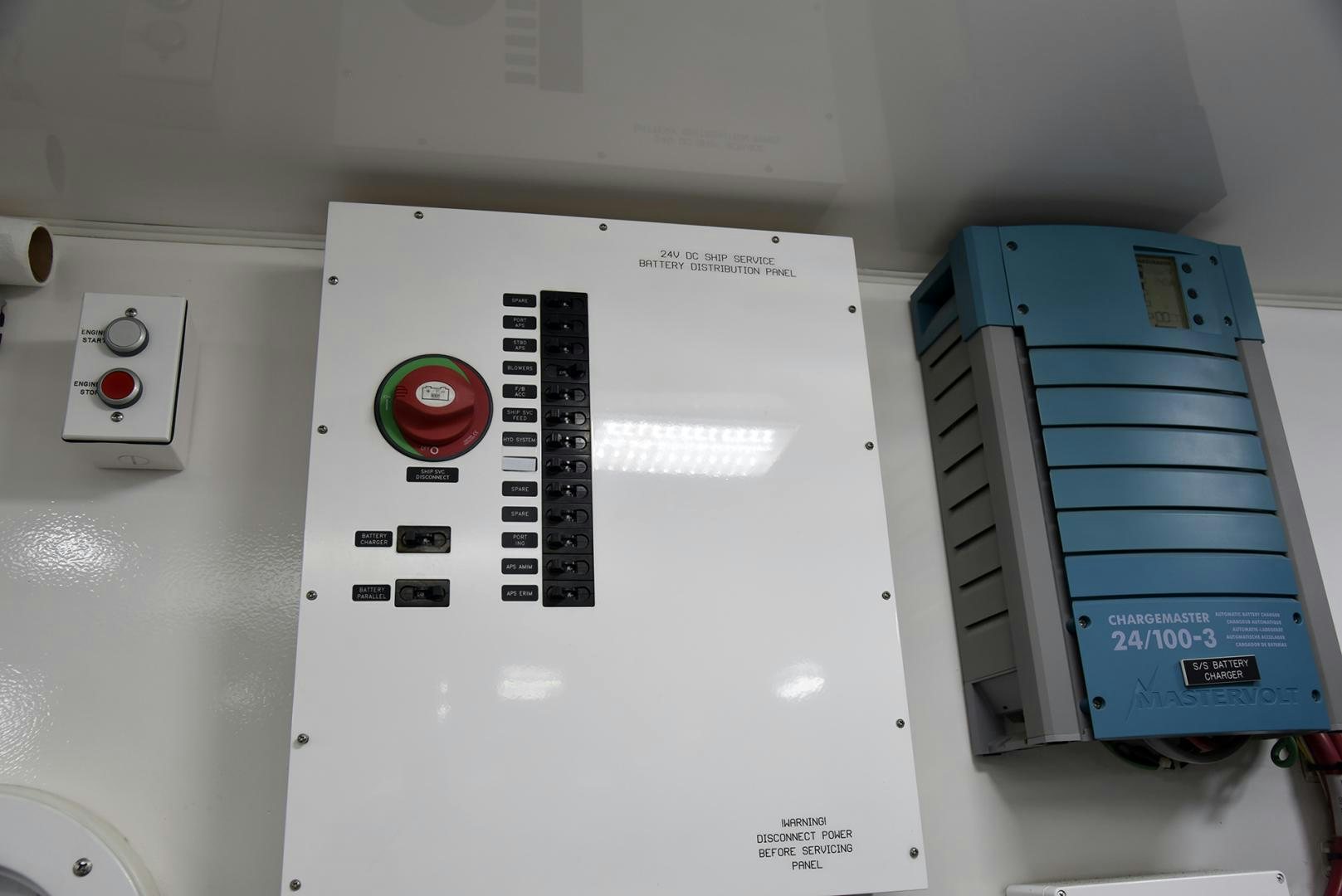 a white box with a red button and a blue box with a black label on it aboard SALTY K Yacht for Sale